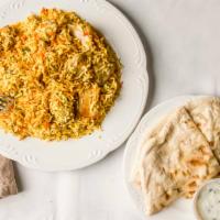 Chicken Biryani · Marinated chicken slow cooked in layers  with long grain basmati rice sealed  in large heavy...