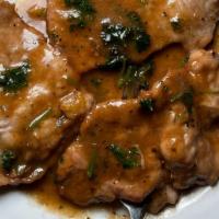 Veal Marsala With Spaghetti · Thinly sliced veal cooked in marsala wine sauce.