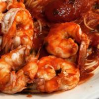 Shrimp Marinara With Spaghetti · Highest quality large eastern gulf sourced shrimp cooked in marinara tomato sauce.