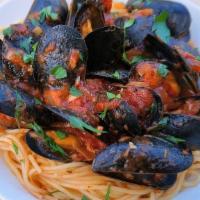 Mussels Linguini · Fresh mussels over spaghetti in either (red) marinara tomato sauce or (white) garlic broth (...