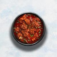 Lamb Vindaloo · Tender lamb morsels marinated in vinegar and garlic cooked to perfection with hot Indian aro...