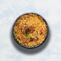 Lamb Biryani · Long grain basmati rice cooked with tender lamb and aromatic Indian herbs. Served with raita.