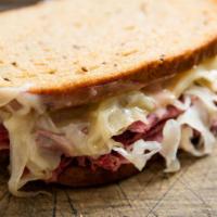 Classic Reuben Sandwich · First cut corned beef, swiss, sauerkraut, russian dressing on grilled rye bread.