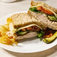 Turkey Delight Sandwich · Sliced turkey breast, bacon, swiss, avocado, sprouts, lettuce, tomato on multi-grain bread.