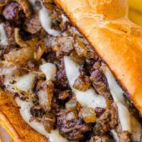 Steak & Cheese · Sliced rib-eye steak, provolone, grilled onions, lettuce, tomato and mayonnaise. Includes Ch...