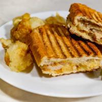 Grilled Chicken Panini · Chicken breast, provolone cheese, tomato, red onion and pesto mayonnaise. Includes Chips