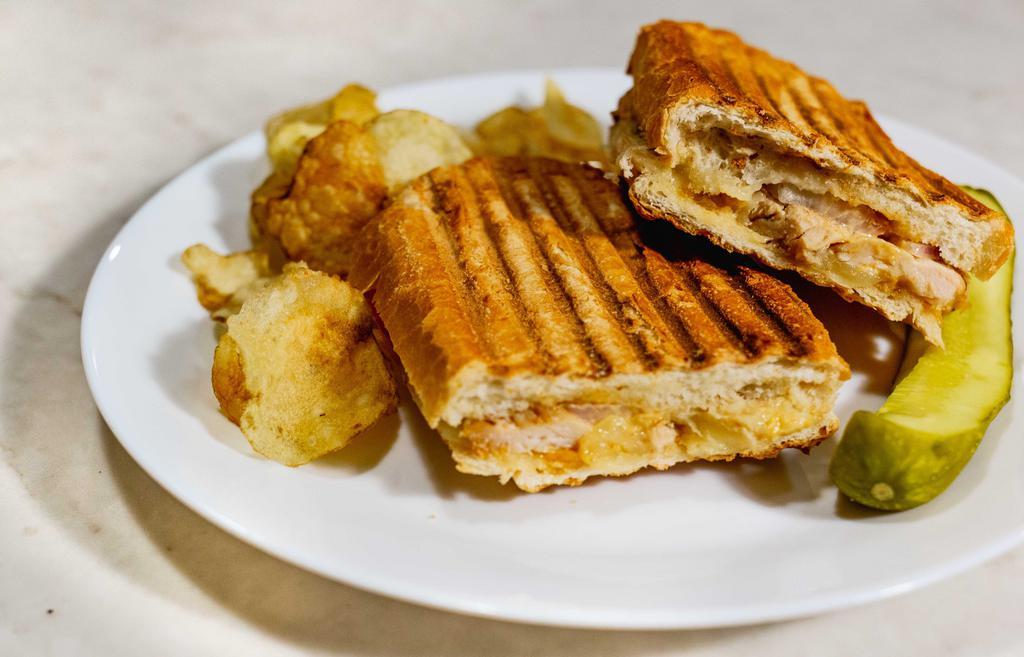 Grilled Chicken Panini · Chicken breast, provolone cheese, tomato, red onion and pesto mayonnaise. Includes Chips