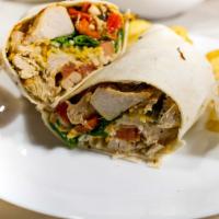 Chicken Fajita Wrap · Grilled chicken, grilled onions, grilled peppers, shredded cheese, and lettuce, with tomato ...