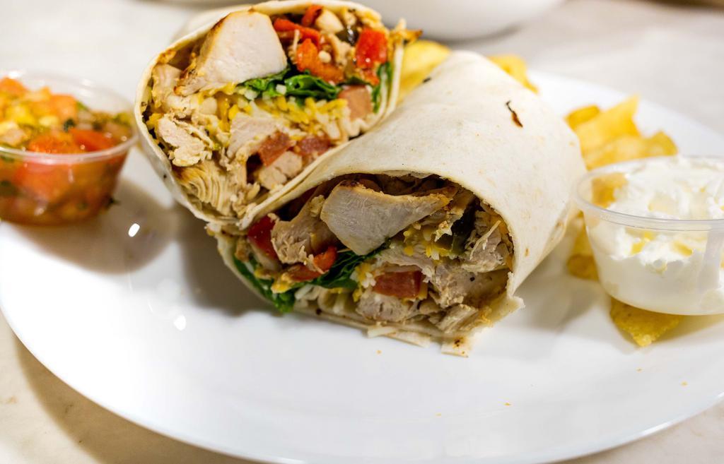 Chicken Fajita Wrap · Grilled chicken, grilled onions, grilled peppers, shredded cheese, and lettuce, with tomato salsa and sour cream on the side. Includes Chips