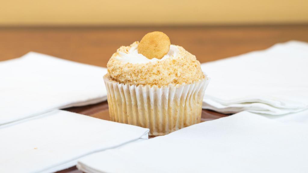 Banana Pudding · Fluellen cupcakes signature flavor. Fresh banana cake topped with a cream cheese frosting and garnished with a vanilla wafer.