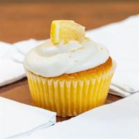Lemon Delight · A fresh lemon cupcake topped with lemon zest cream cheese frosting and garnished with a lemo...