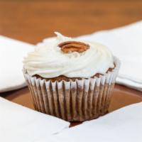 Carrot Cake · Classic cinnamon carrot cake topped with a cream cheese frosting and pecan pieces..