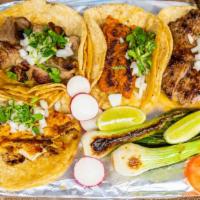 Tacos · Tortilla de Maiz. Cilantro, onion, rabano, lemon, grilled onion, grilled jalapeños, green or...