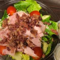 Blt Club With Blue Cheese Salad · Crisp Lettuce topped with Bacon, Ham, Turkey, Tomatoes, Cucumbers, Carrot Shreds, and Co-jac...