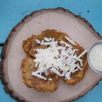 Fried Plantain Patties · Served with venezuelan mozzarella cheese and house sauce