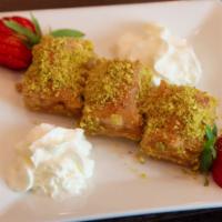 Baklava · Crispy phyllo dough layered with walnuts topped with honey simple syrup.