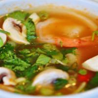 Tom Yum Soup · The world famous Thai soup spiced with chilies, lemongrass, mushrooms and lime juice. Spicy.