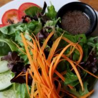 Side Green · Vegan. Gluten-Free. Mixed greens, carrot, Roma tomato, cucumber and balsamic vinaigrette.