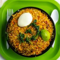 Chicken Biryani · Aromatic basmati rice slow cooked with chicken leg and thigh pieces.