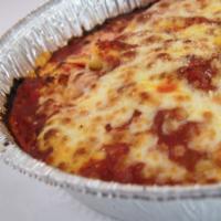Lasagna · Layers of pasta with homemade marinara sauce, sautéed ground beef, Mozzarella cheese and Ric...