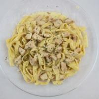 Fettuccine Alfredo · Creamy Parmesan sauce over fettuccine. Served with garlic bread.