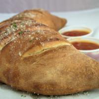 Create Your Own Calzone · Tomato sauce, Mozzarella cheese and Ricotta cheese with your choice of three toppings.