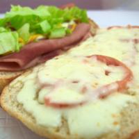 Ham & Cheese Sandwich · Ham and Mozzarella cheese with lettuce, tomatoes, mayonnaise and mustard. Served on fresh ba...