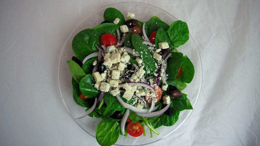 Spinach Salad · Fresh baby spinach, tomatoes, red onions, Kalamata olives, Gorgonzola cheese and balsamic vinaigrette. Served with garlic bread.