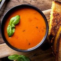 Tomato Basil Soup · Thick, rich cup of soup made with perfectly ripe tomatoes, cream and fragrant basil Topped w...