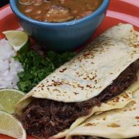 Slow Cooked Barbacoa · With onions and cilantro.