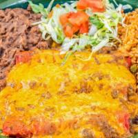 Enchiladas San Antonio · Cheese filled enchiladas topped with Texas style chili con carne and cheddar cheese.