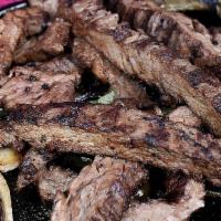 Fajitas (Small) · Charbroiled beef or chicken, served on a iron skillet with pico de gallo sour cream and guac...