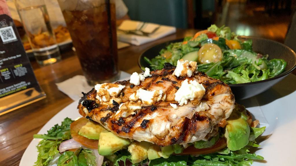 Chicken & Goat · balsamic glaze, avocado, tomato, spring mix, softened goat cheese, on open-faced sourdough. (Shown with Salad)