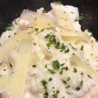 Garlic Shrimp Risotto · White wine garlic cream, green onions and parmesan.