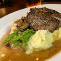 Peppered Filet · Crusted with black pepper corns, mushroom brandy sauce, creamy mashed potato and asparagus.