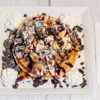 Oreo Cheesecake · Topped with fried Oreos and chunks of cheesecake, crumbled Oreos and drizzled in chocolate s...