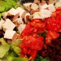 125Th St. Cobb Salad · A customer favorite! Broiled chicken, diced tomatoes, avocado, bacon bits, eggs and bleu che...