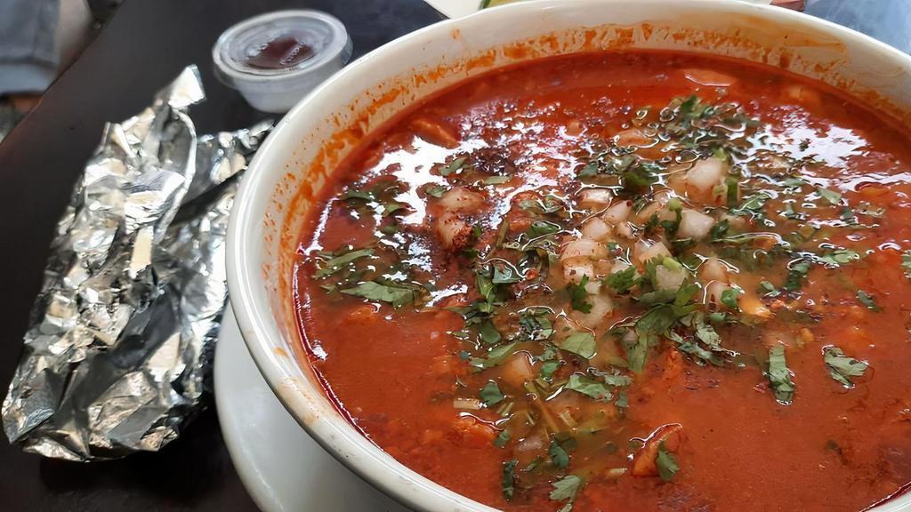 Sopa De Mariscos · A delicious seafood broth with clams, shrimp, mussels, scallops, fish.