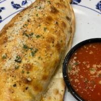 Stromboli · Pepperoni, sausage, Canadian bacon, hamburger wrapped in pizza crust served with marinara.