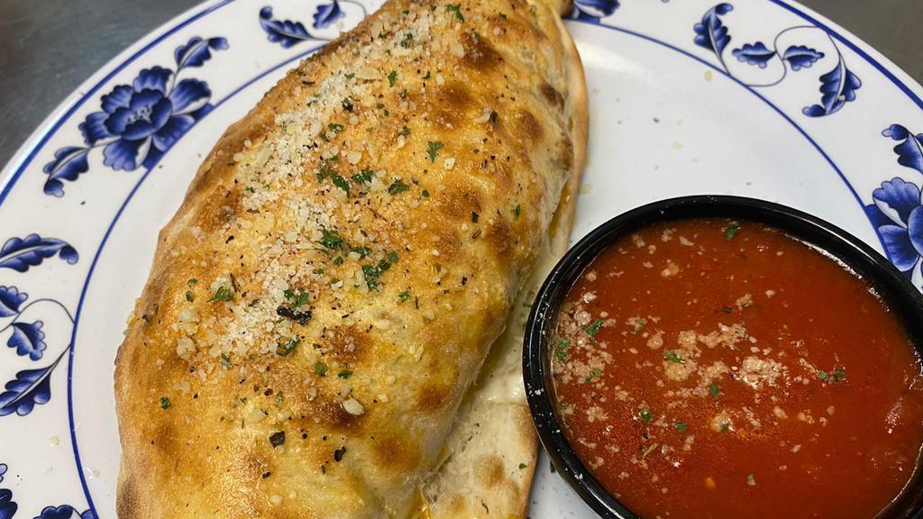 Stromboli · Pepperoni, sausage, Canadian bacon, hamburger wrapped in pizza crust served with marinara.