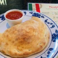 Calzone · Sausage, Mozzarella and ricotta cheese, wrapped in pizza crust, served with marinara sauce.