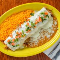 Burrito Tapatio · A very tasty sautéed pork burrito with beans and smothered with melted cheese. Served with S...