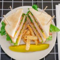 Triple Decker King Club · Sliced turkey, ham, bacon, American cheese, lettuce, tomatoes, and mayo served on toast with...