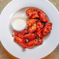 Chicken Wings · Oven baked bone-in wings, your choice of buffalo, BBQ, Cajun dry rub or plain. Served with o...