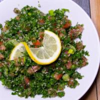 Tabouli · Finely chopped fresh parsley and tomatoes mixed with burghul, fresh mint tossed in a lemon j...