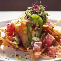 Volcanic Nachos · Our one-of-a-kind nachos come with melted cheddar cheese, pico de gallo, black beans and jal...