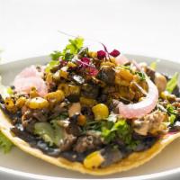 Tacos · Corn tortillas with grilled chicken or black angus steak, lettuce, pico de gallo and sour cr...