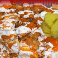Loaded Tots  · Potato tots, chicken, Buffalo Sauce, ranch, cheese, pickles.