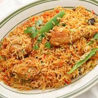 Chicken Biryani · Basmati rice cooked with chicken and gravy.