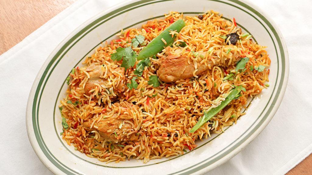Chicken Biryani · Basmati rice cooked with chicken and gravy.
